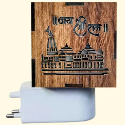 Wooden notebook with engraved design and white pen on a beige background